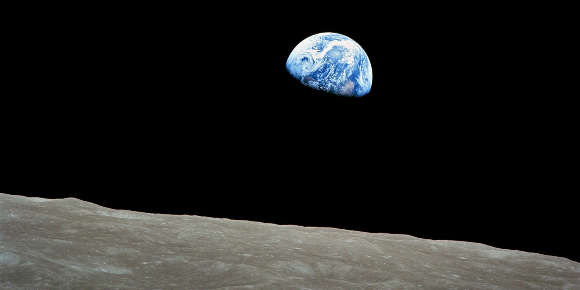      "Earthrise" is the first image of Earth captured by humans from space.      The photo of Earth was taken aboard Apollo 8 on December 24, 1968, by lunar module pilot Bill Anders.     The image made people aware of Earth's fragility, since it was seen against the blackness of space.  On December 24, 1968 — exactly 50 years ago — Apollo 8 astronauts Frank Borman, Jim Lovell, and William Anders became the first humans to circle the moon.