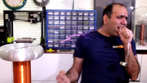 Fun with Electricity and the Crazy Angry Iranian Electricity Guy – ElectroBoom – shorting some UK fuses and singing with tesla coils